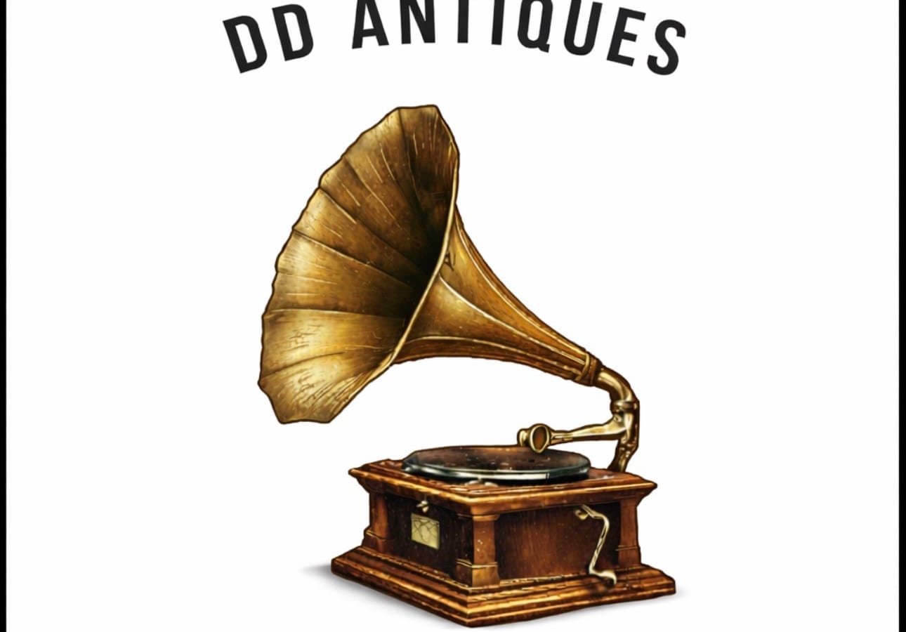 The owners of DDAntiques examining a piece in the shop
